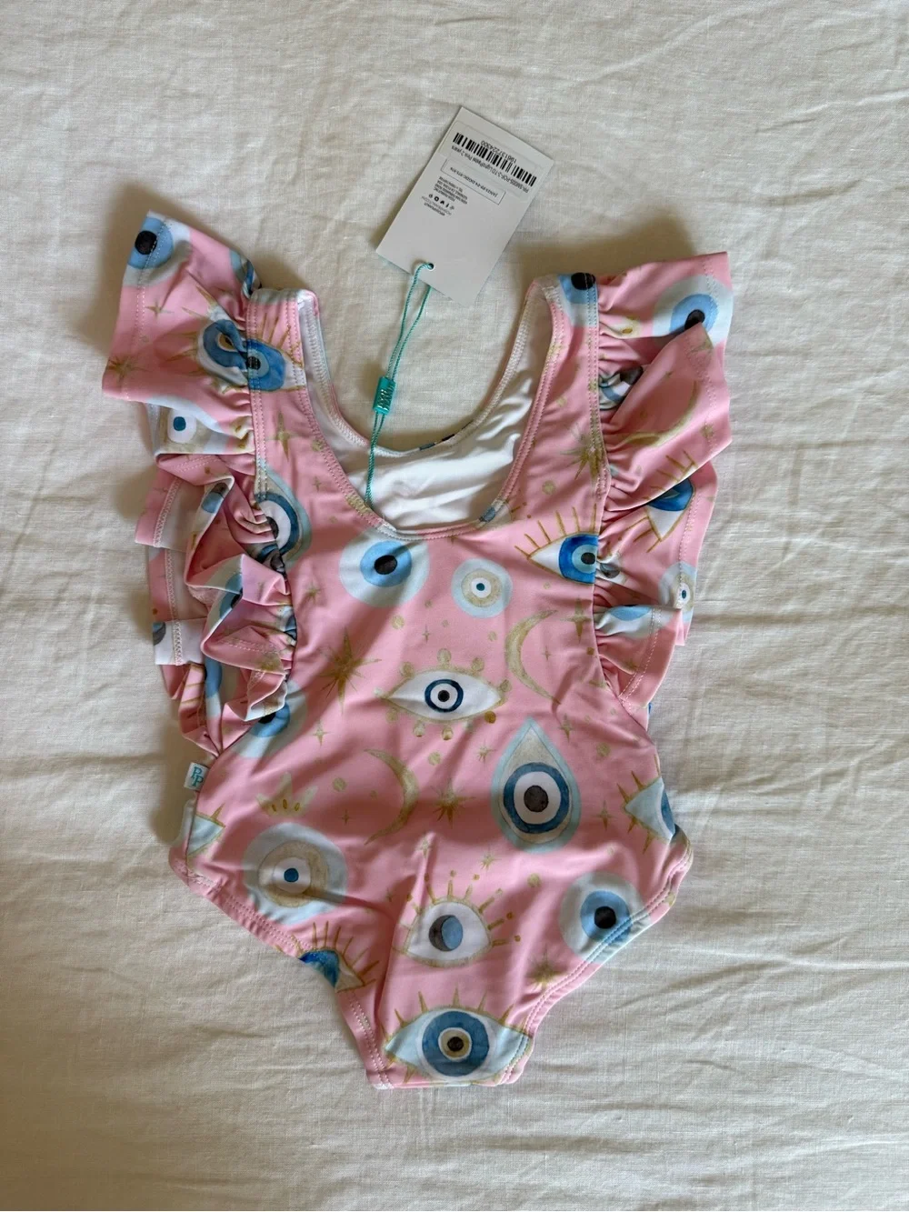 Posh Peanut Pink Evil Eye Ruffle One-Piece Swimsuit | 2T